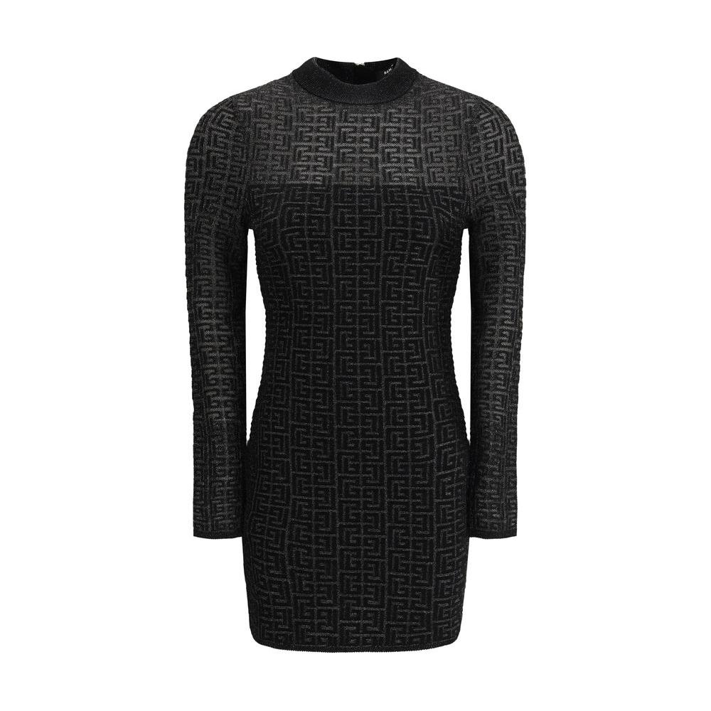 Balmain knit mini dress with long sleeves and iconic logo pattern, featuring a back zipper for a modern, sleek silhouette.