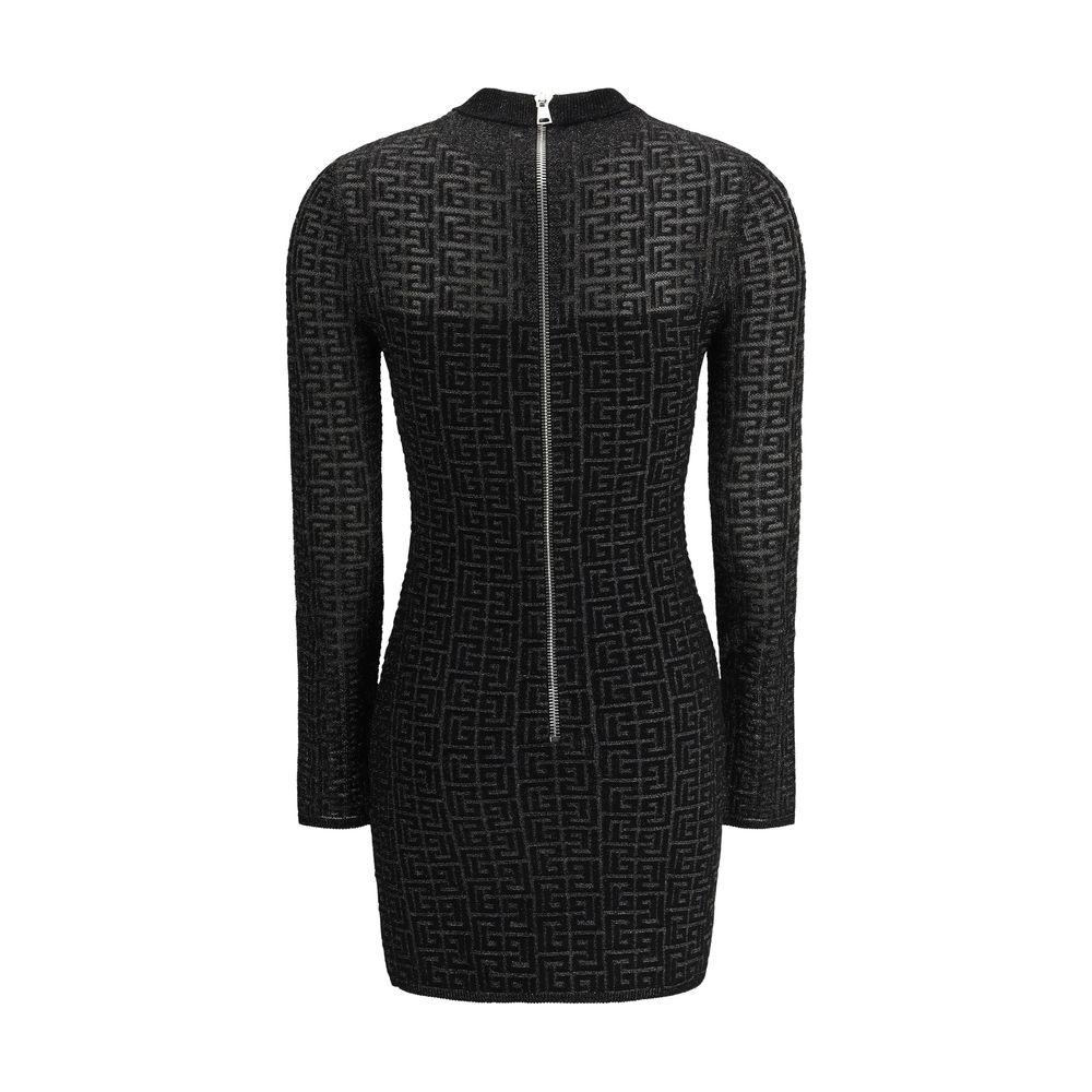 Balmain Knit Mini Dress with long sleeves, back zipper, and bold logo pattern for a modern, elegant silhouette.