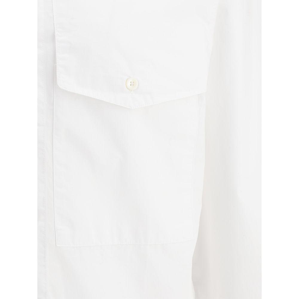 Close-up of white cotton Sunflower Shirt showing a buttoned patch pocket and classic collar, ideal for a classic monochrome look.