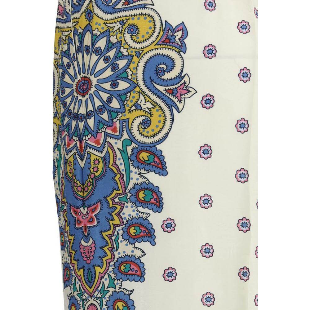 Close-up of Etro Paisley Print Pants in vibrant blue, yellow, and red silk showcasing elegant paisley design and intricate details.