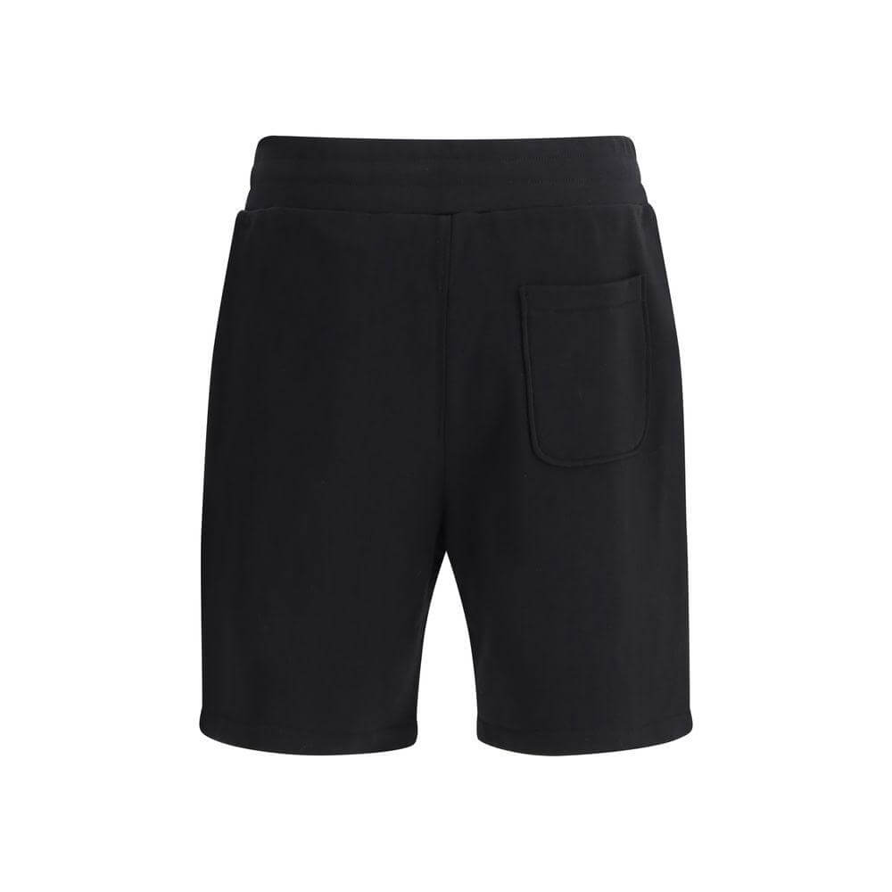 Moschino black cotton sweatpants shorts with elastic waistband, knee length, featuring iconic monogram and Teddy Bear logo for casual style.