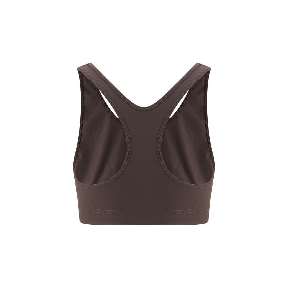 Back view of Jil Sander Sport Top featuring a cropped, stretchy design with elegant back straps and iconic monogram, enhancing style.