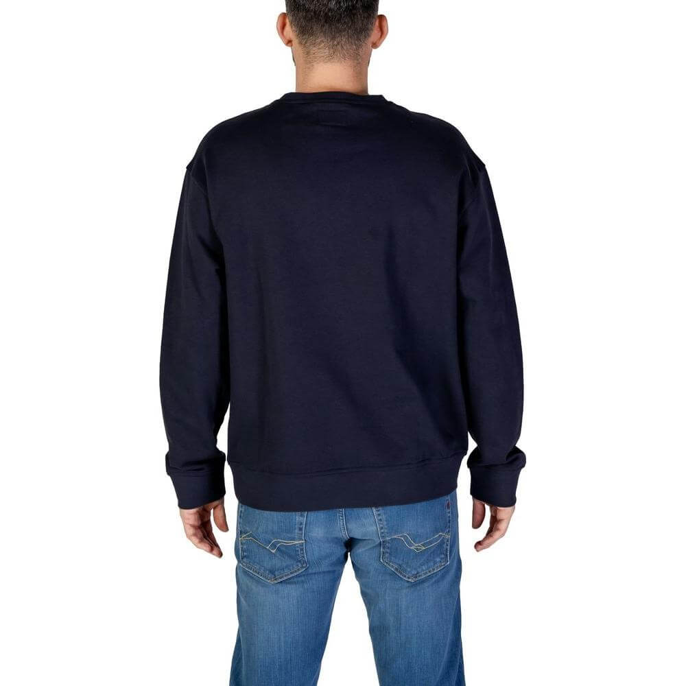 Back view of man wearing Refrigiwear blue cotton sweater, part of men's fall/winter collection. 100% cotton sweatshirt.
