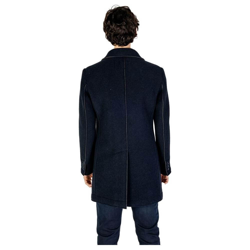 Rear view of man wearing Hydra Clothing blue wool jacket, part of men's fall/winter collection, made of wool and synthetic fibers.