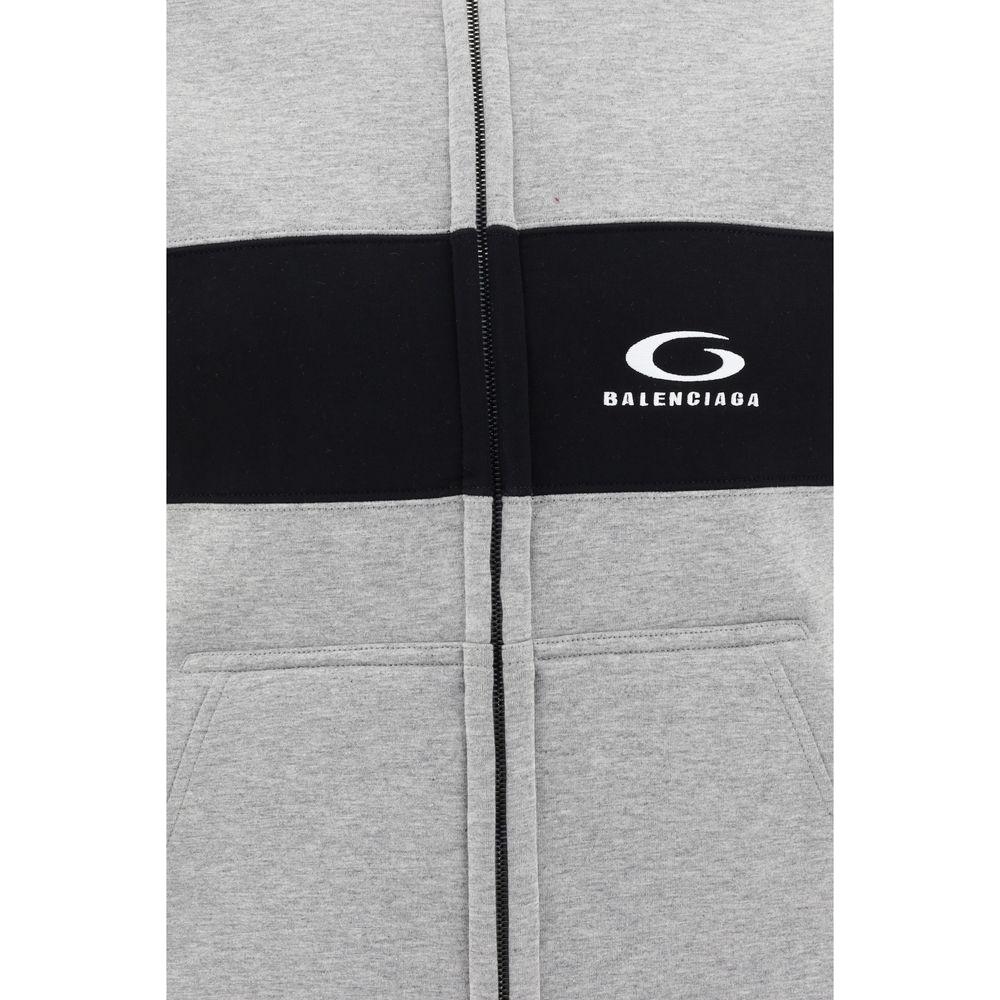 Balenciaga cotton hoodie with zip closure and contrasting panel design, showcasing modern urban style with practical side pockets.