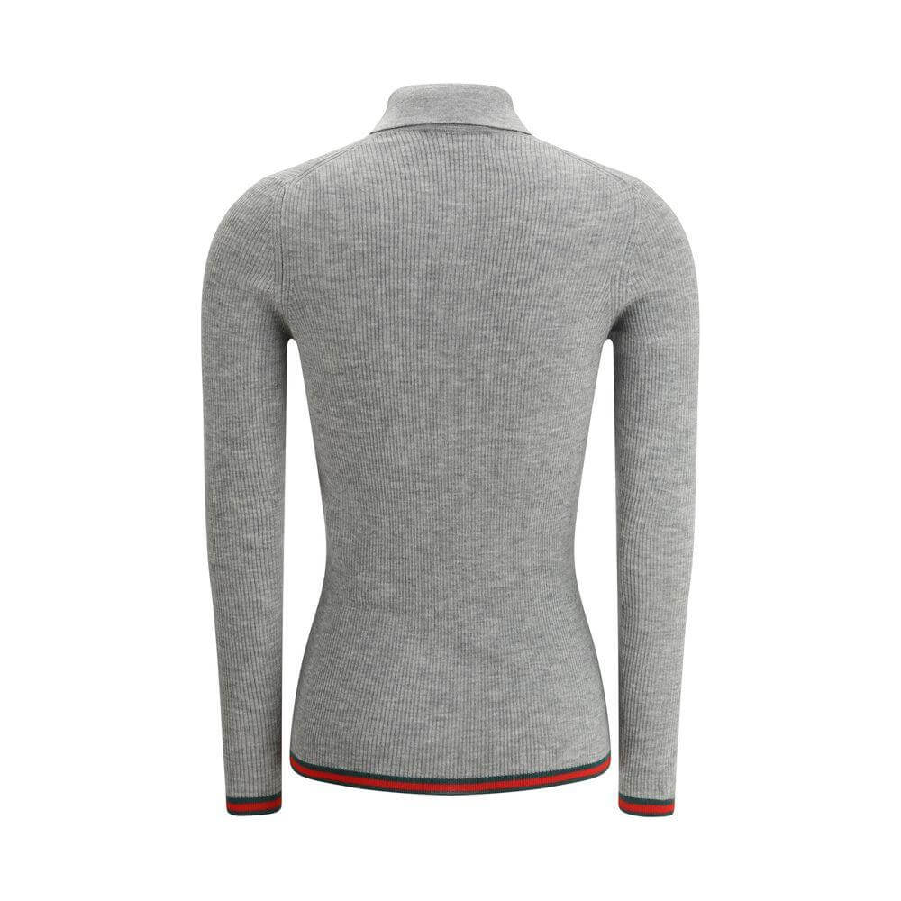 Back view of Gucci cashmere polo shirt with ribbed design, long sleeves, and iconic colored bands on hem and cuffs.