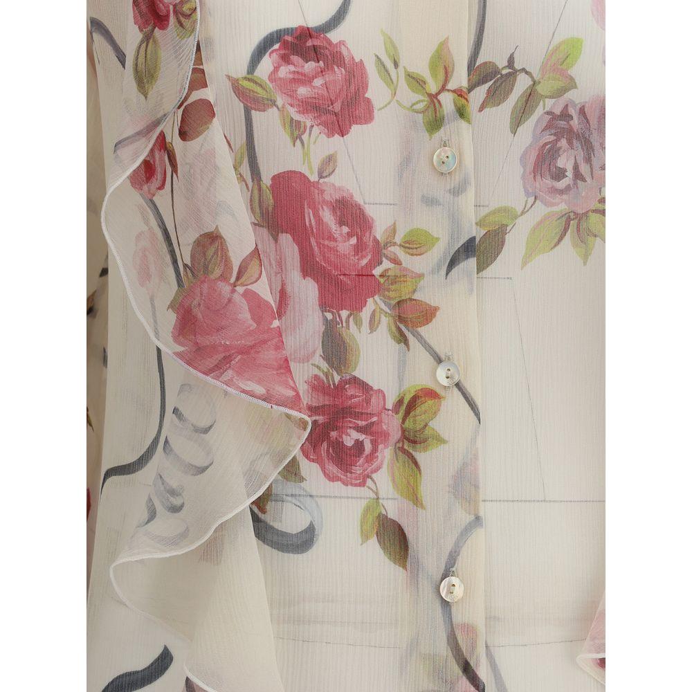 Blumarine floral silk chiffon shirt with ruffled details and classic collar, featuring pink rose pattern for an elegant, feminine look.