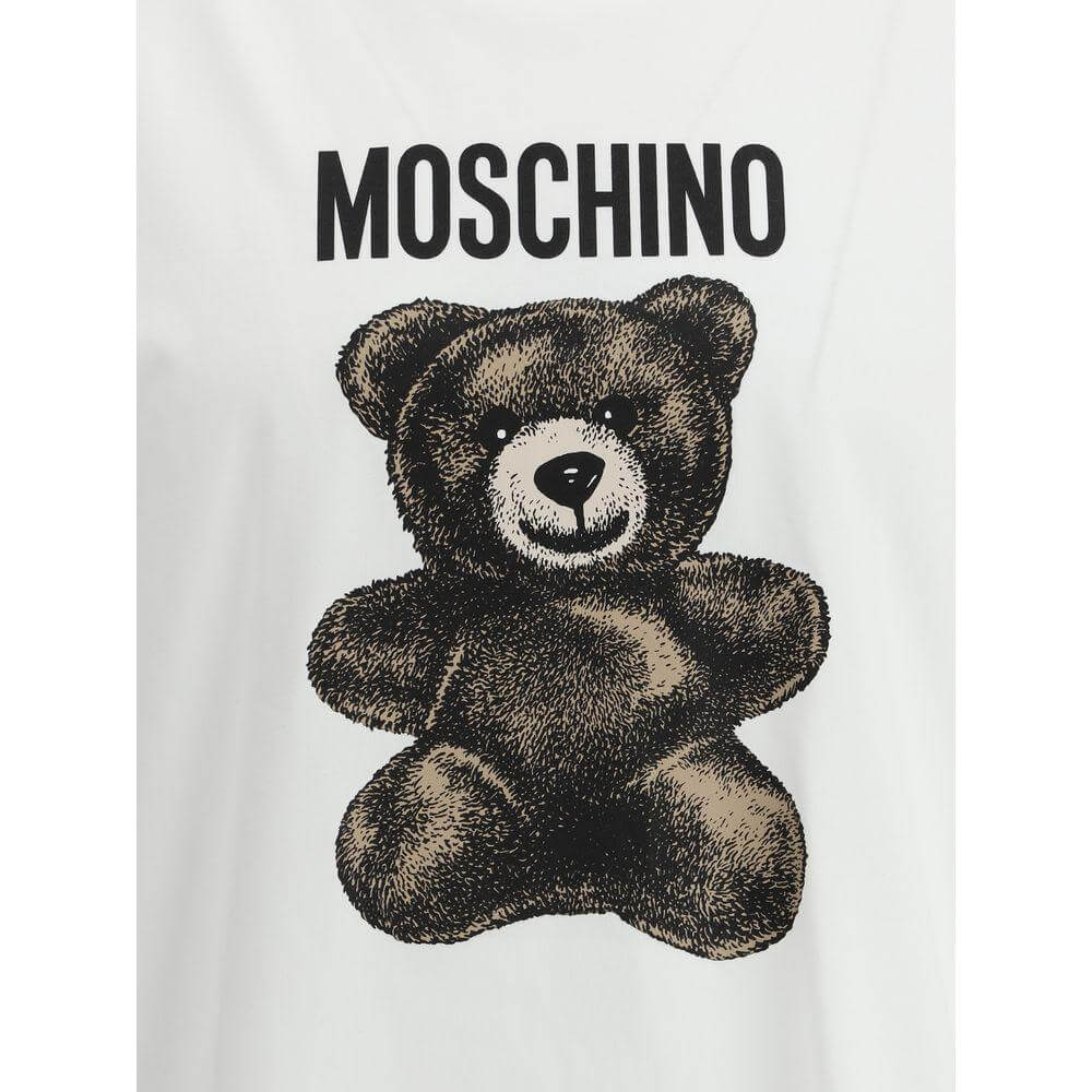 Moschino T-shirt featuring a bold teddy bear print and iconic logo, highlighting playful and stylish design.