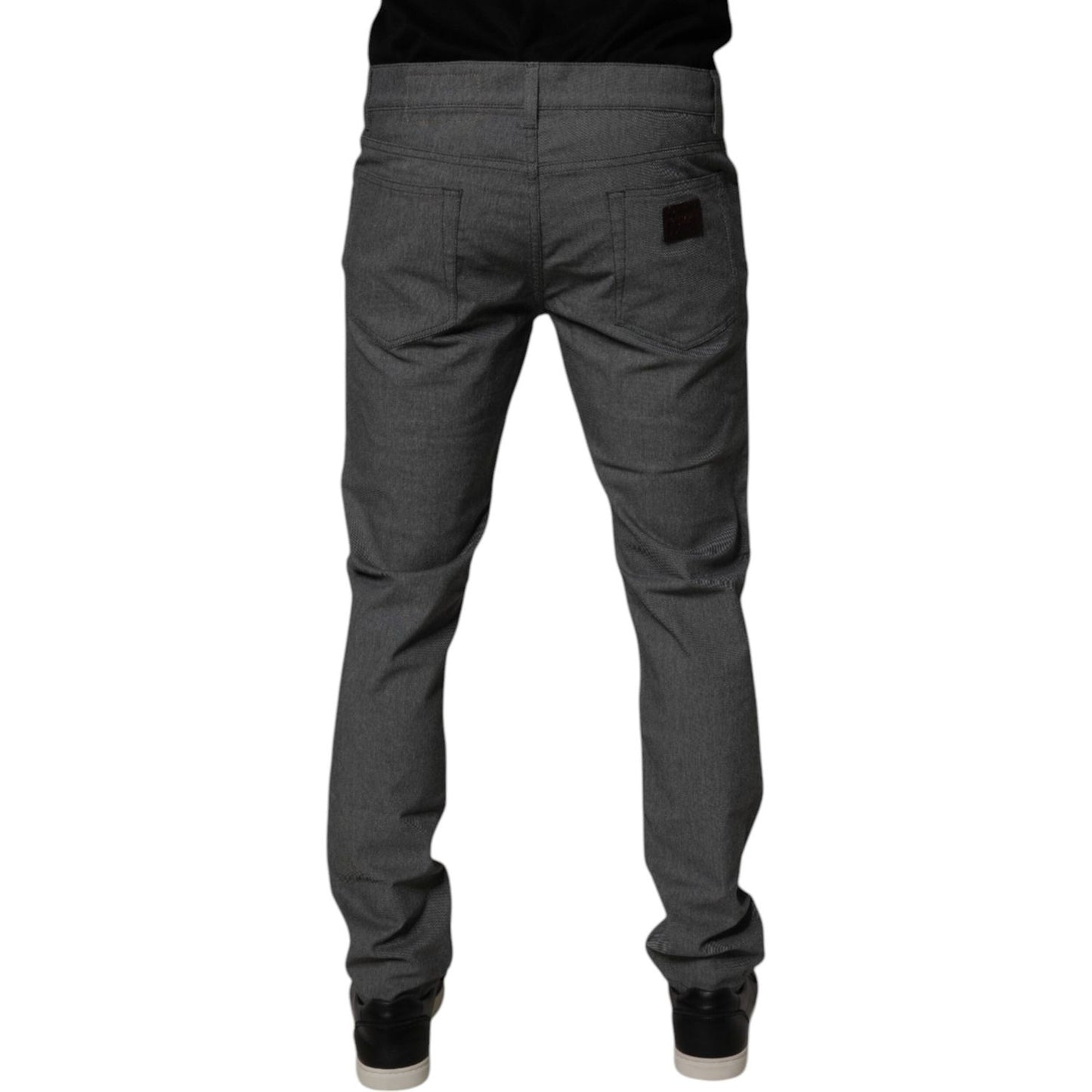 Back view of gray Dolce & Gabbana cotton stretch skinny denim jeans, featuring classic fit and logo details. Made in Italy.