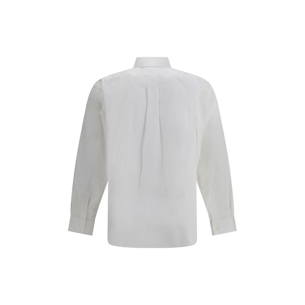 Back view of Comme des Garçons monochrome cotton shirt with classic collar, button closure, and adjustable cuffs, showcasing elegance.