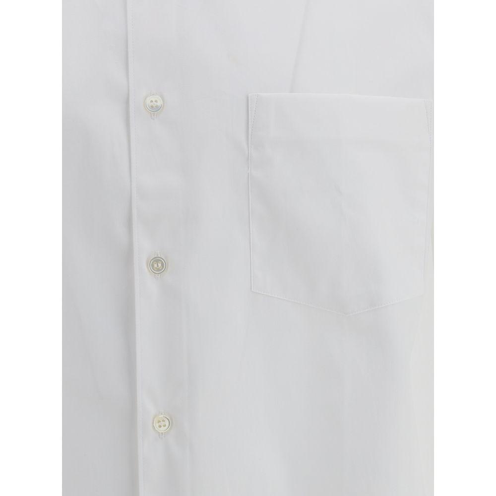 Comme des Garçons monochrome cotton shirt with classic collar, button closure, and chest pocket.