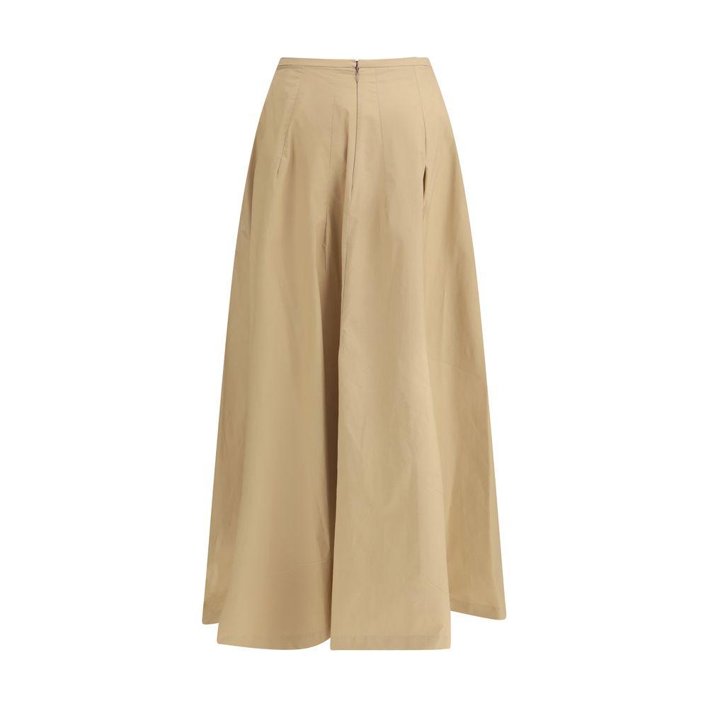 The Latest cotton Amphora Skirt, long and wide with back zipper, slit, and welt pockets, offering a modern and sophisticated look.