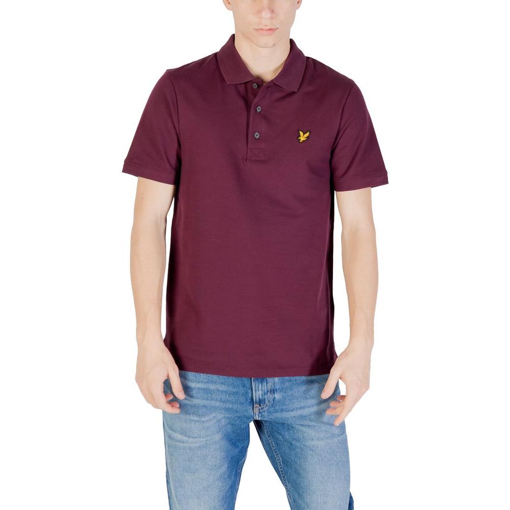 Man wearing Lyle & Scott Bordeaux Cotton Polo Shirt with logo, paired with blue jeans, showcasing short-sleeve design for casual occasions.