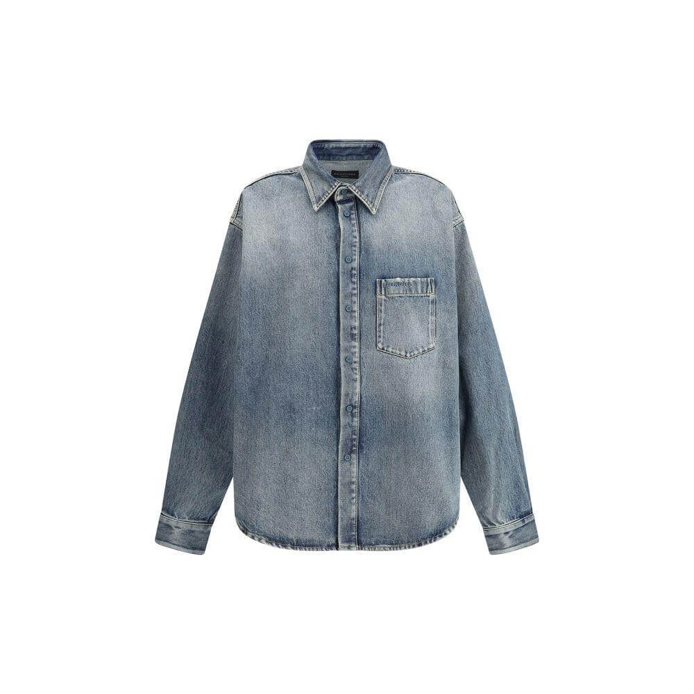 Balenciaga oversized denim-effect cotton shirt with classic collar, snap-button closure, and monogram applique on chest.