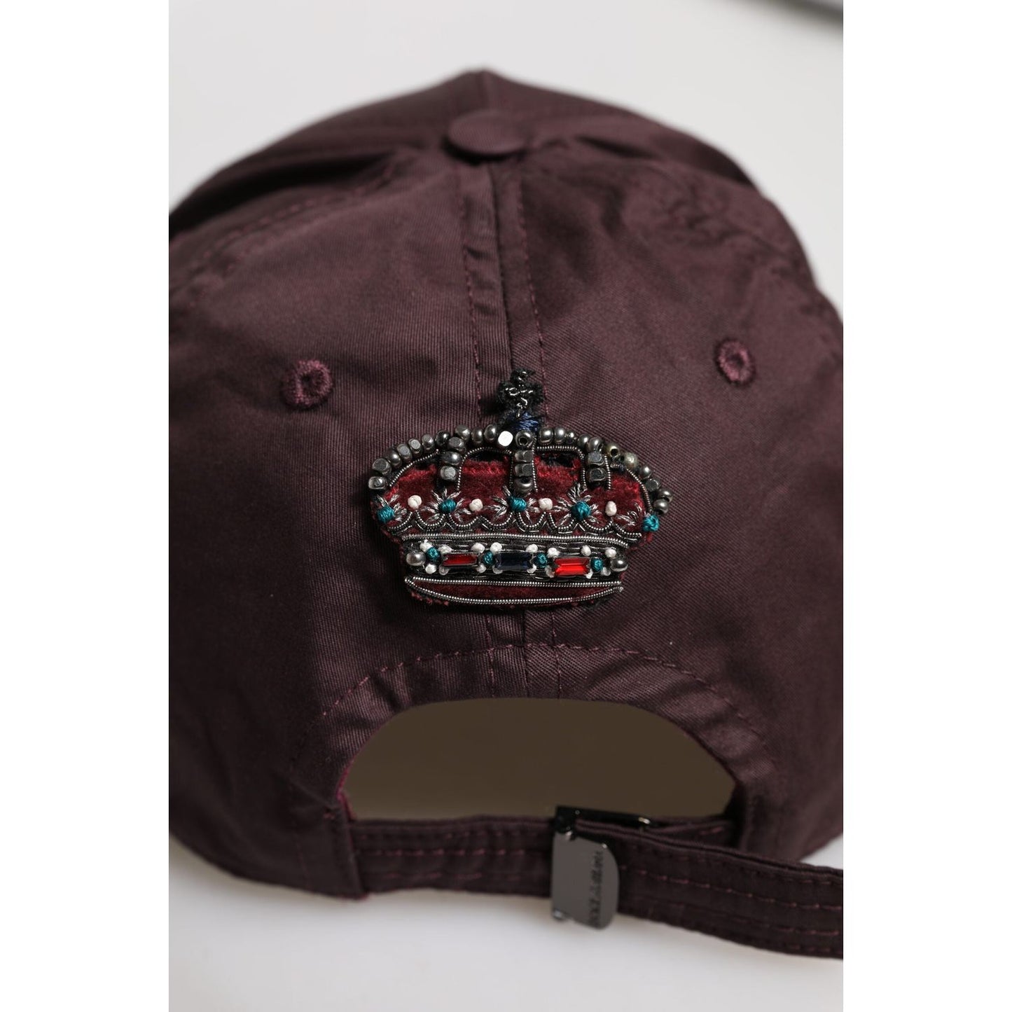 Dolce & Gabbana brown baseball cap back view with crown detail, crafted from cotton and silk blend, featuring adjustable strap.