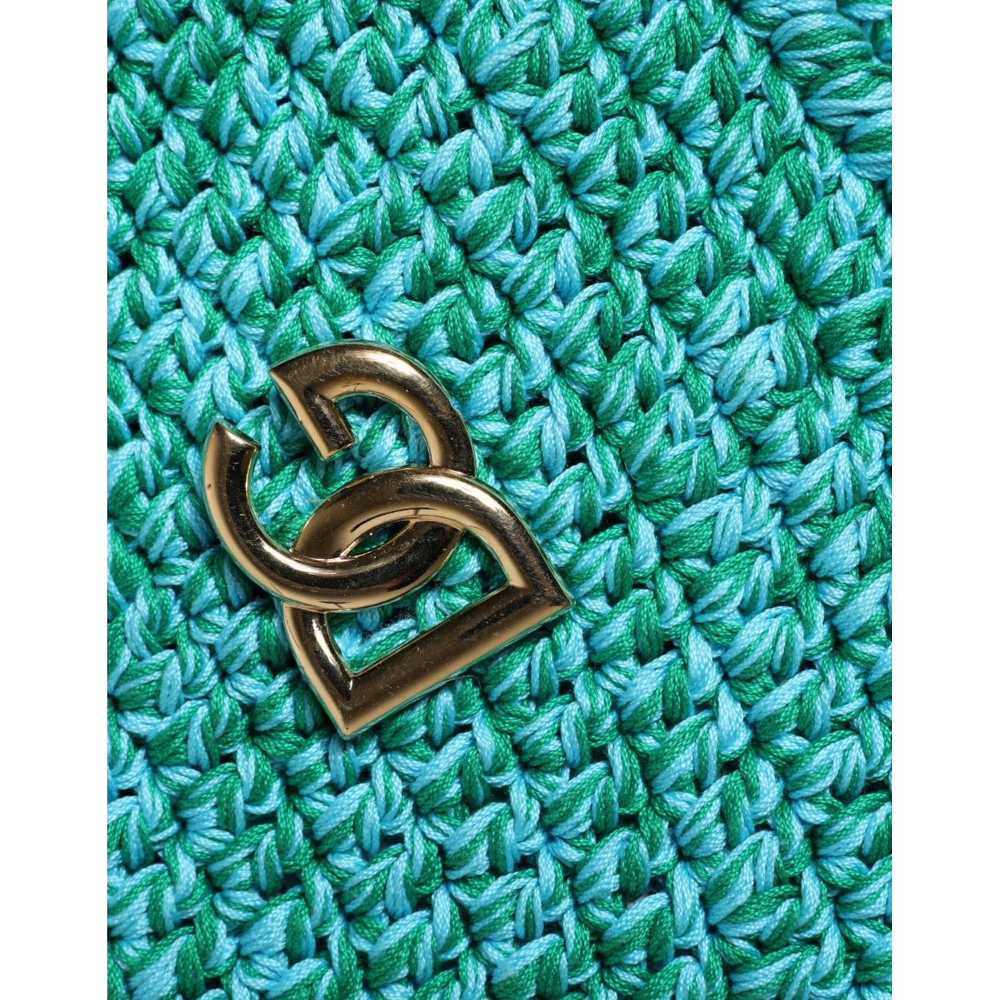 Close-up of Dolce & Gabbana green cotton crochet DG logo on a bucket hat.