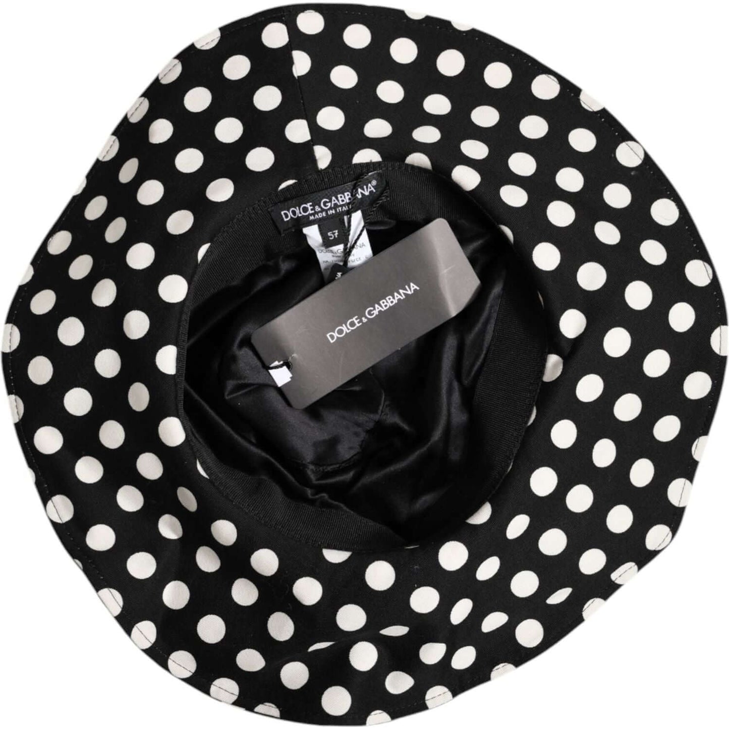 Dolce & Gabbana black and white polka dot wide brim bucket hat with silk lining, featuring logo detail, made in Italy.