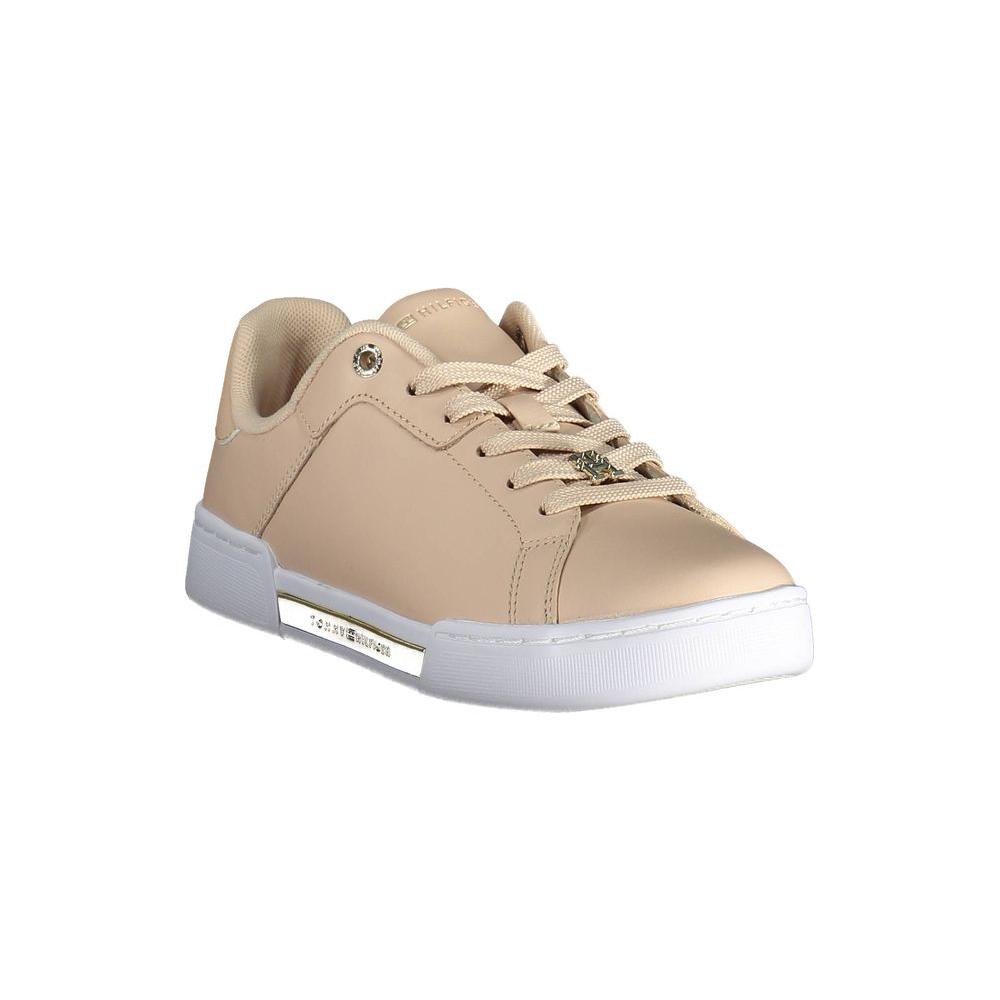 Tommy Hilfiger pink leather women's sneaker with white sole and logo detail, showcasing modern and stylish footwear design.