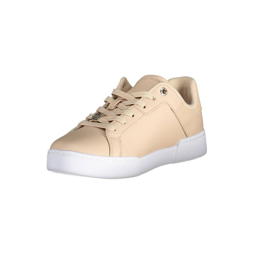 Tommy Hilfiger pink leather women's sneaker with white sole featuring iconic logo and stylish design.