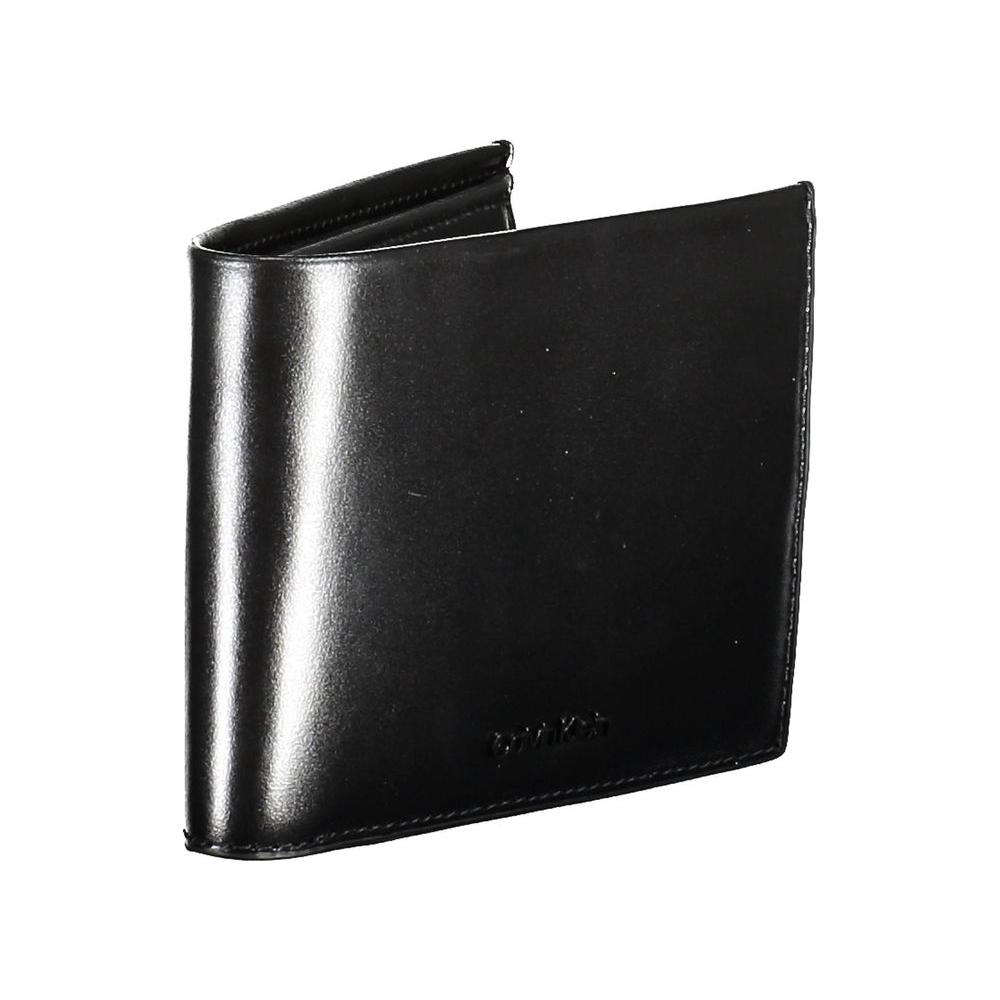 Calvin Klein black leather men's wallet with embossed logo, featuring dual compartments and RFID blocking technology for security and style.
