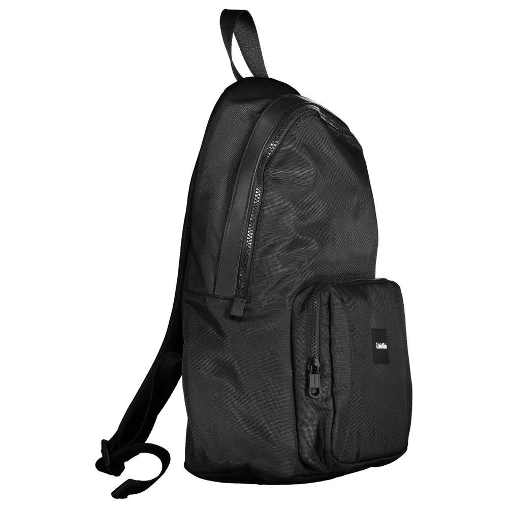 Calvin Klein black polyester men's backpack with logo, featuring a sleek design, external pocket, and secure compartments for urban style.