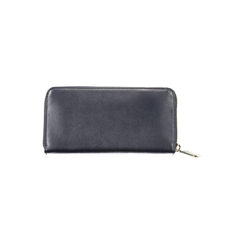 Tommy Hilfiger blue leather women's wallet with zip closure, featuring logo and multiple compartments for cards and coins.