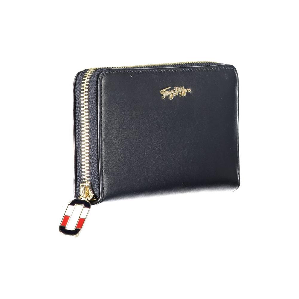 Tommy Hilfiger blue leather women's wallet with gold logo and zip closure, featuring multiple compartments for cards and coins.