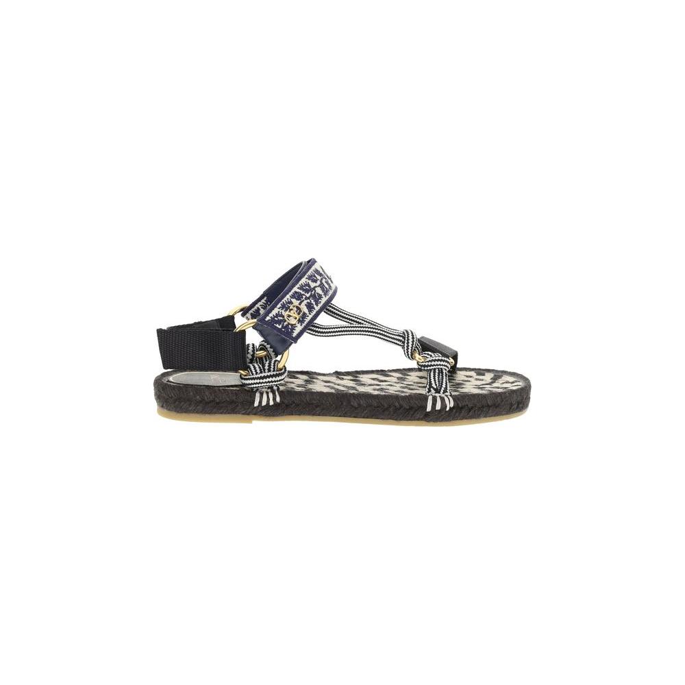 Valentino Garavani Lake Powell Sandals with metallic VLogo, flat rope sole, double Velcro straps in black and white. Perfect for summer.