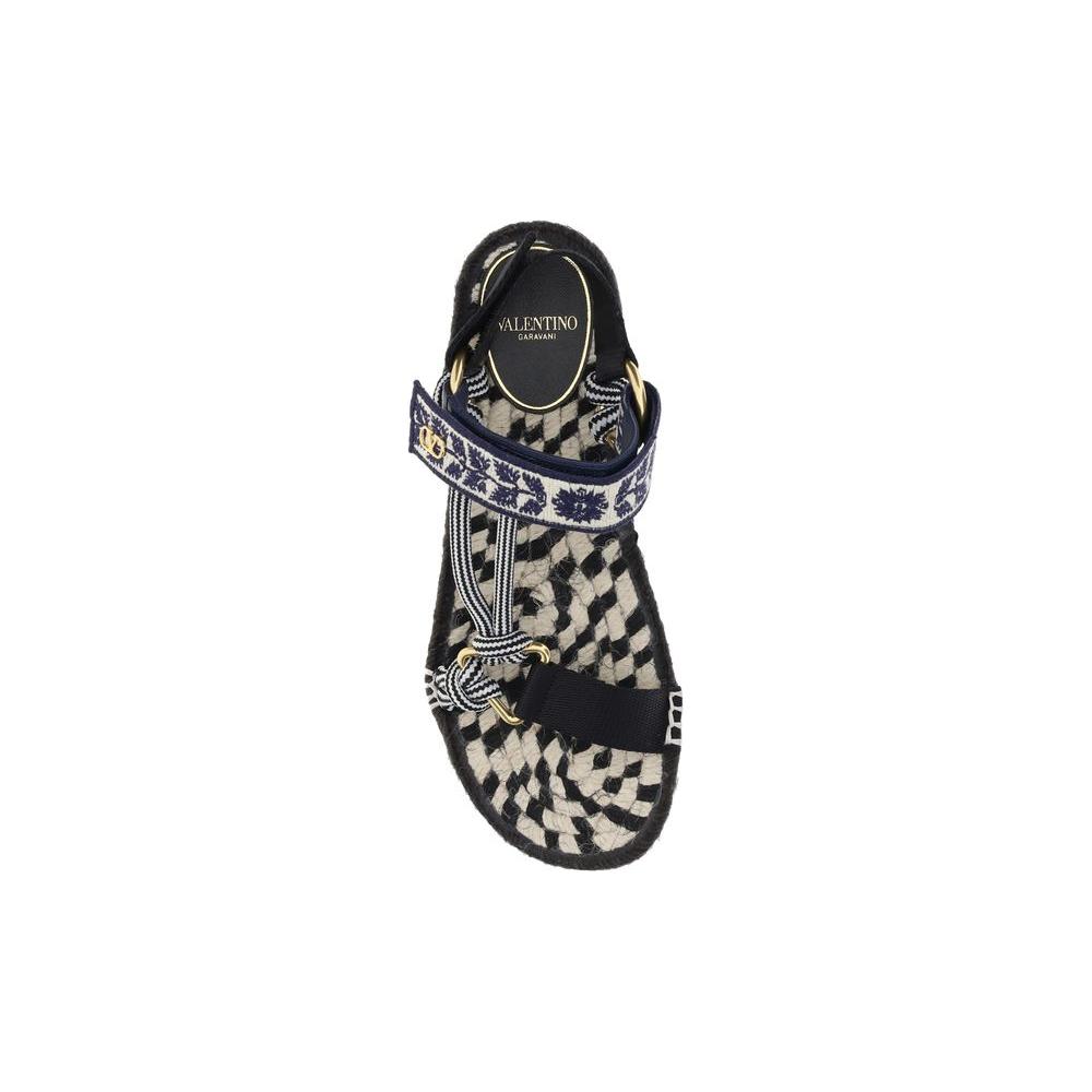 Valentino Garavani Lake Powell Sandals with VLogo, featuring double Velcro strap and flat rope sole for summer elegance and comfort.