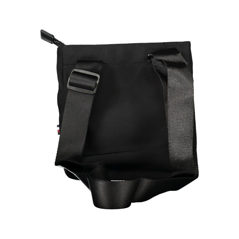 Tommy Hilfiger black recycled polyester shoulder bag with adjustable strap and zip closure, featuring the brand logo.