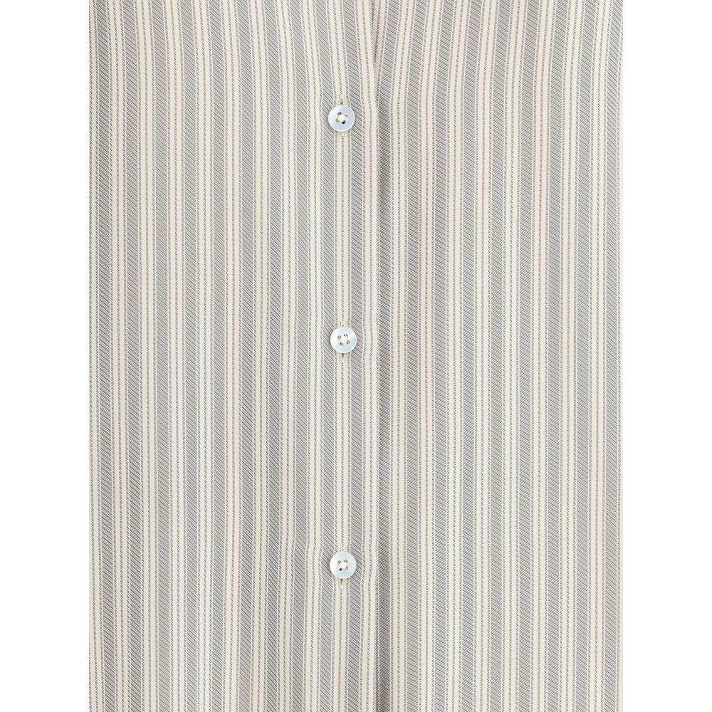 The Row Parave Shirt in fine striped silk with classic collar and button closure showcasing minimalist sophistication.