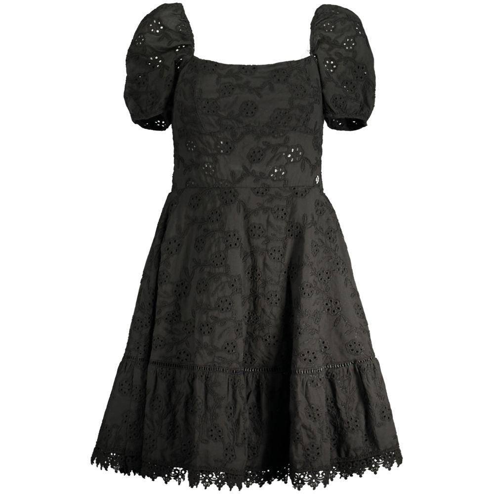 Guess Jeans black cotton women's dress with short sleeves, boat neck, intricate embroidery, and Guess logo, embodying chic elegance.