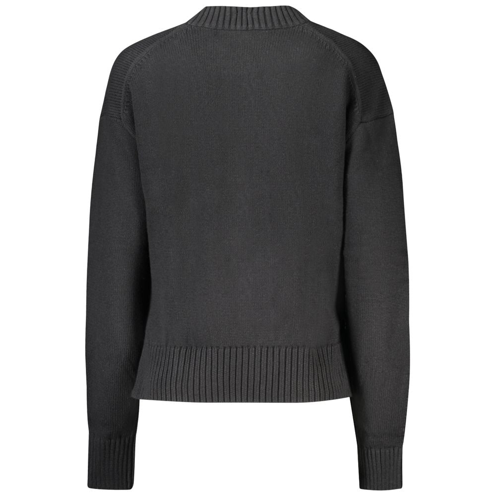 Back view of Calvin Klein black cotton women's sweater with high neck and embroidered logo, crafted for modern elegance and comfort.