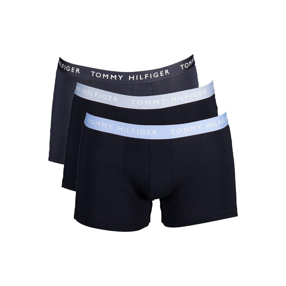 Tommy Hilfiger black cotton men's trunks tri-pack with iconic logo waistband, made with 21% recycled cotton for comfort and style.