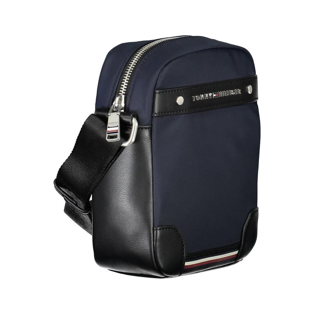 Tommy Hilfiger blue polyester men's shoulder bag with adjustable strap, zip closure, and logo detailing, perfect for urban sophistication.
