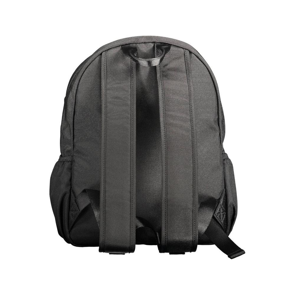 Back view of black Tommy Hilfiger polyester backpack with adjustable straps and side pockets, designed for urban male style.