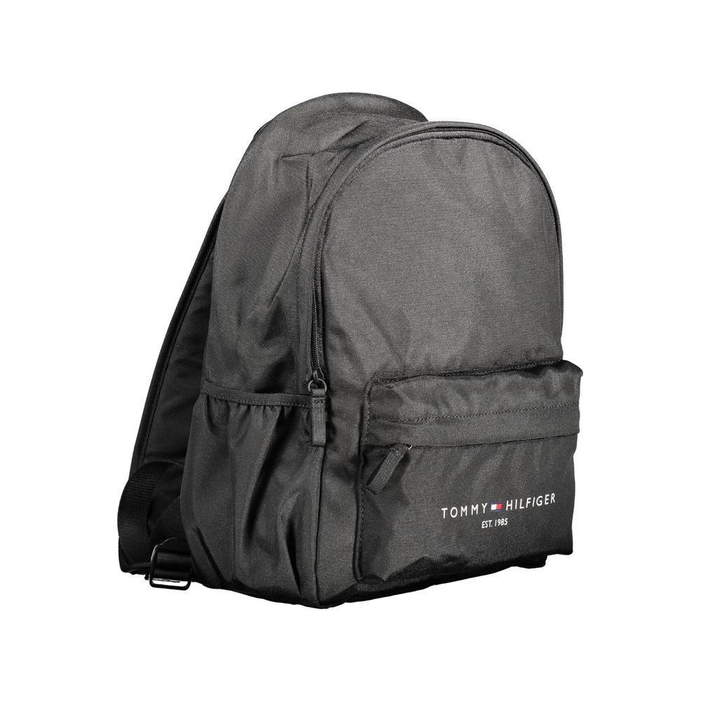 Tommy Hilfiger black polyester men's backpack with top handle, adjustable straps, and multiple pockets for easy organization.
