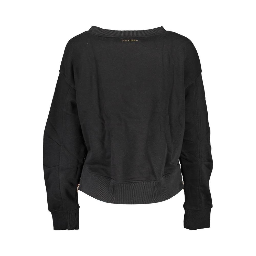 Back view of Guess Jeans black cotton women’s sweater with round neck, long sleeves, side zips, and bold logo detail.