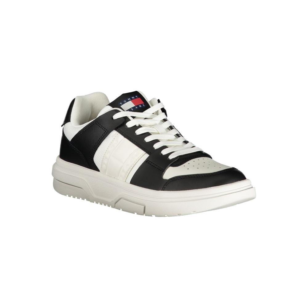 Tommy Hilfiger black leather women's sneaker with white accents and iconic logo, perfect for a stylish, sporty look.