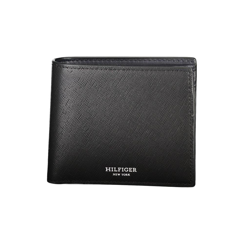 Tommy Hilfiger black leather wallet with 2 compartments, coin purse, space for cards, contrast details, and logo.