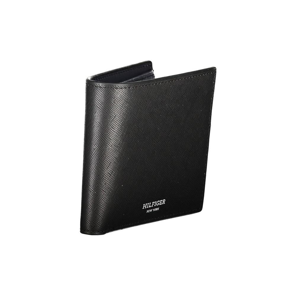 Tommy Hilfiger black leather wallet with two compartments, coin purse, and card slots featuring contrast details and logo.
