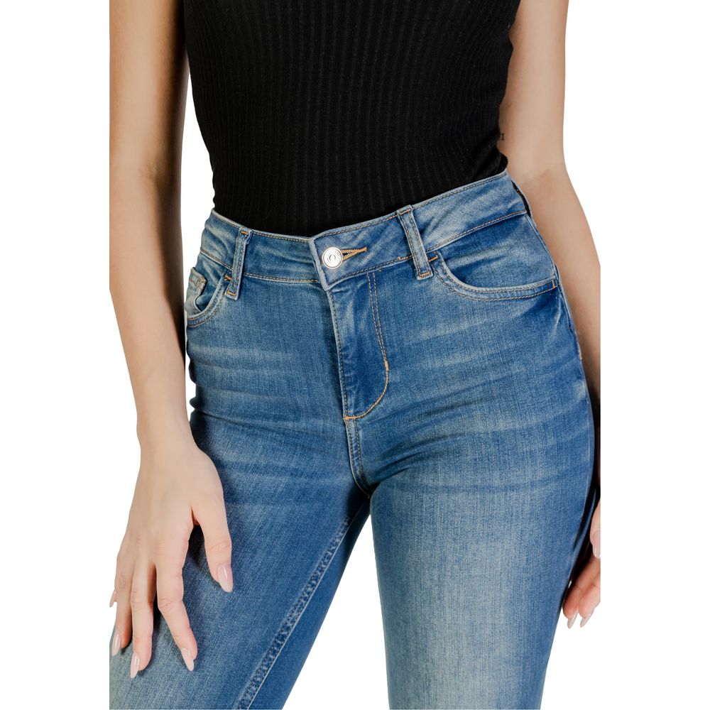 Woman wearing Liu Jo blue cotton jeans, showcasing high waist and flared fit, emphasizing elegant silhouette and contemporary fashion.