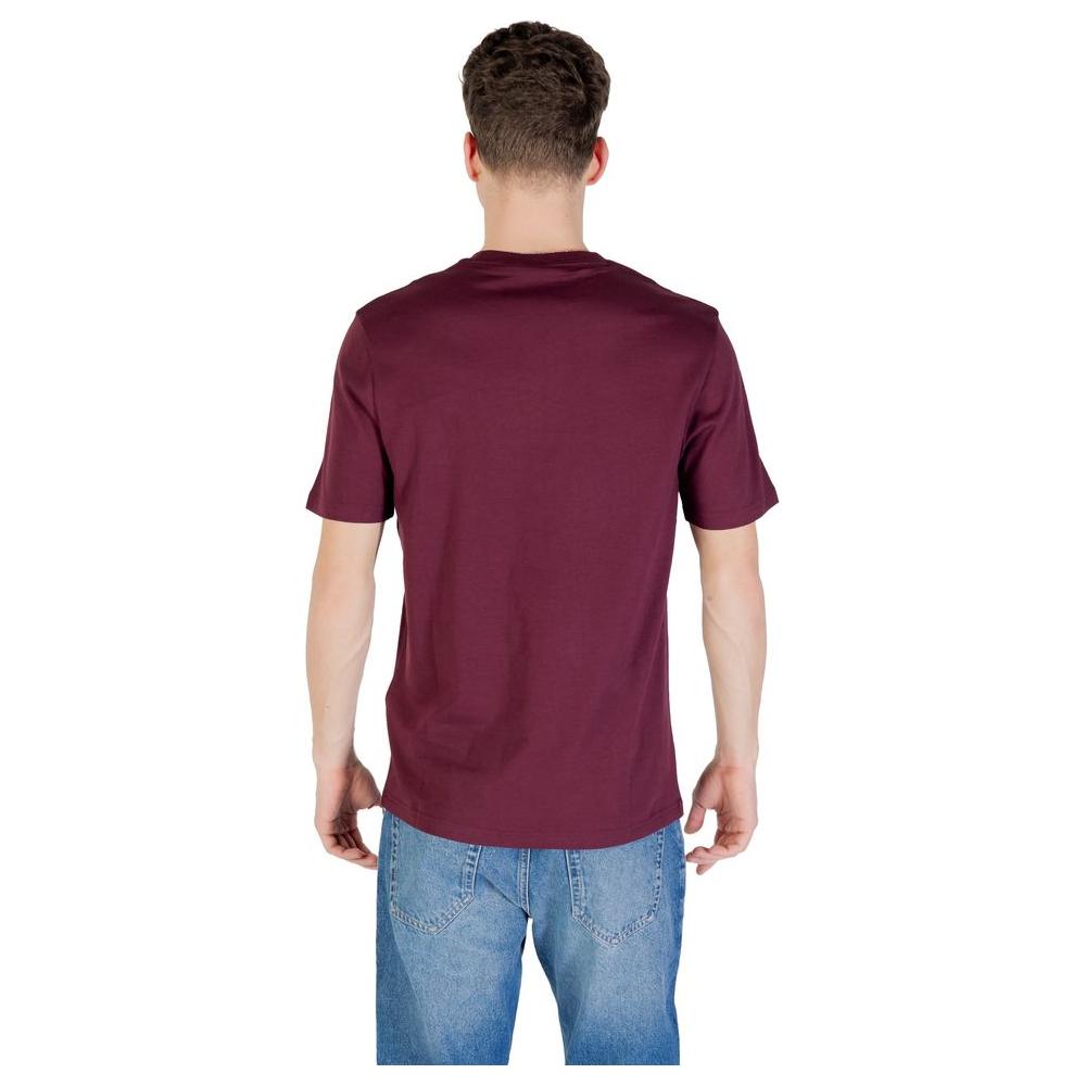 Back view of model wearing Lyle & Scott Bordeaux cotton T-shirt, showcasing casual style with short sleeves and classic fit.