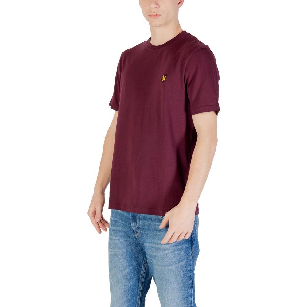 Man wearing Lyle & Scott Bordeaux cotton T-shirt and jeans, showing short-sleeve design and perfect fit for casual wear.
