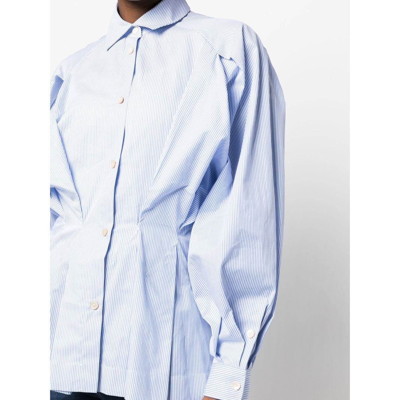 Pastel blue gathered-waist cotton shirt by Palmer//Harding with classic collar and buttoned cuffs, showcasing pleat detailing.