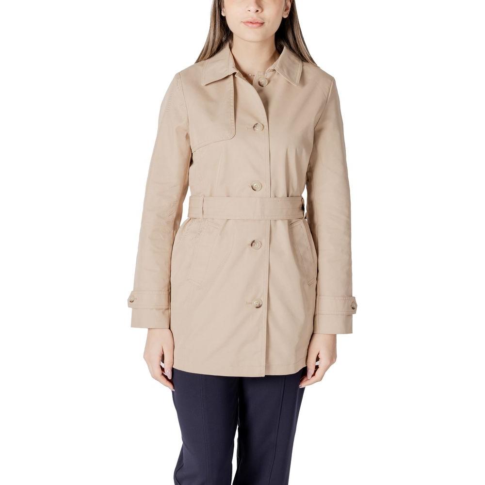 Woman wearing Street One beige cotton trench coat, mid-length with button closure and belt, ideal for transitional seasons.