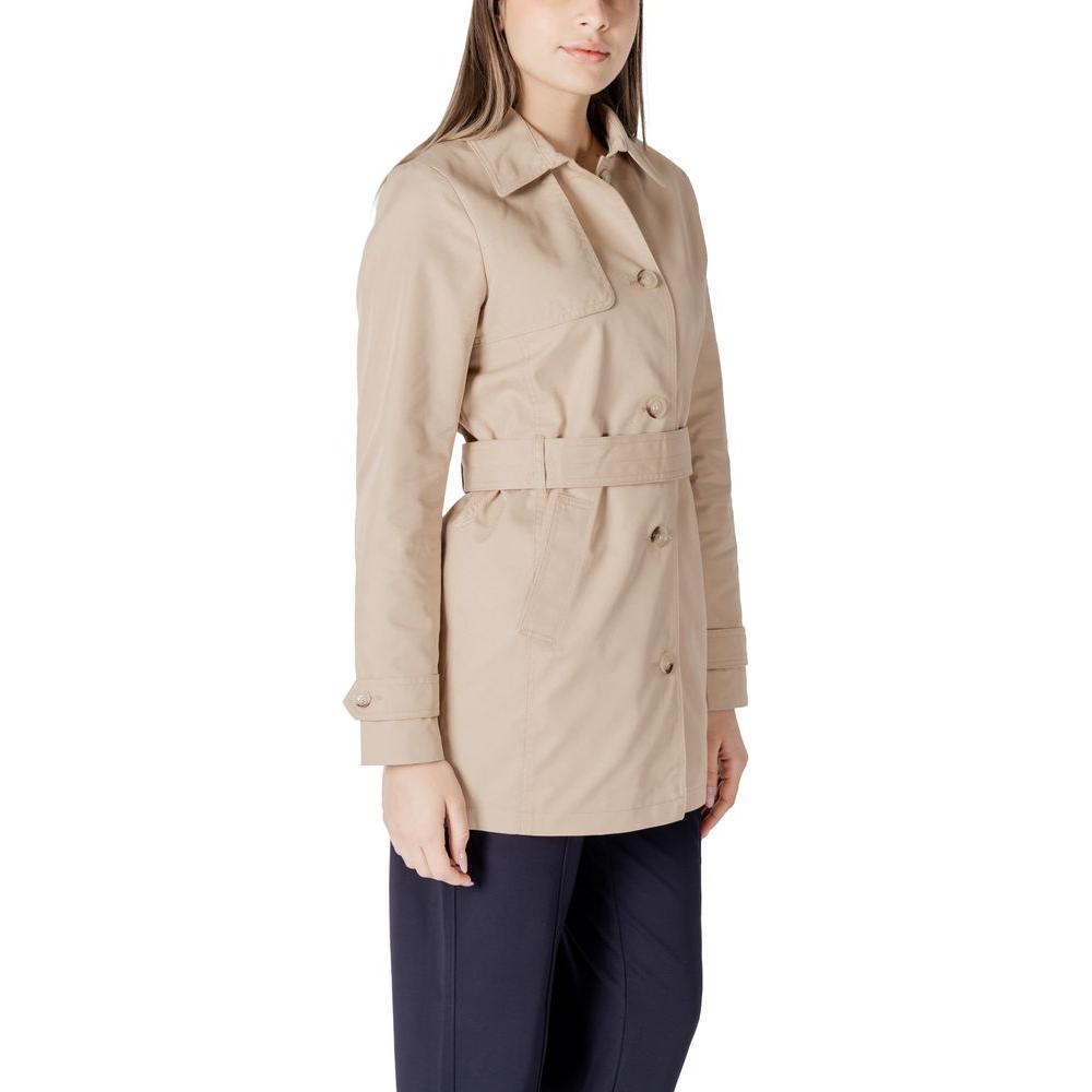 Woman wearing Street One beige cotton trench coat, mid-length, showcasing elegant casual style for transitional seasons.