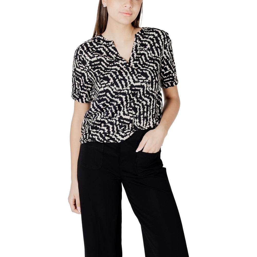 Woman wearing Street One black viscose shirt with pattern, featuring short sleeves and V-neck, paired with black trousers.