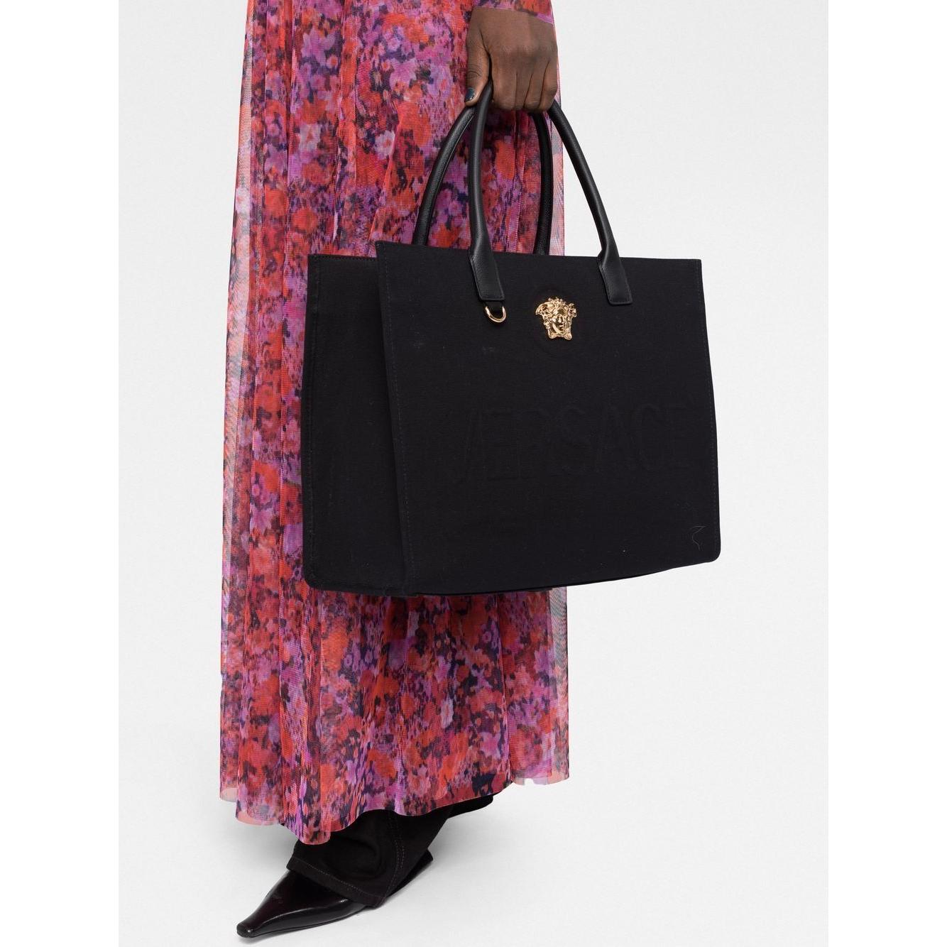Front view with bag zipped and handles upright.