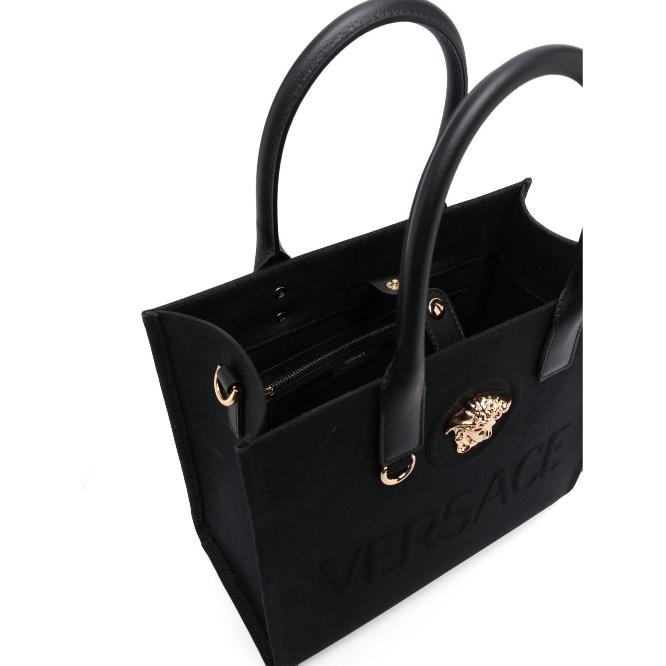 Front view with bag zipped and handles upright.